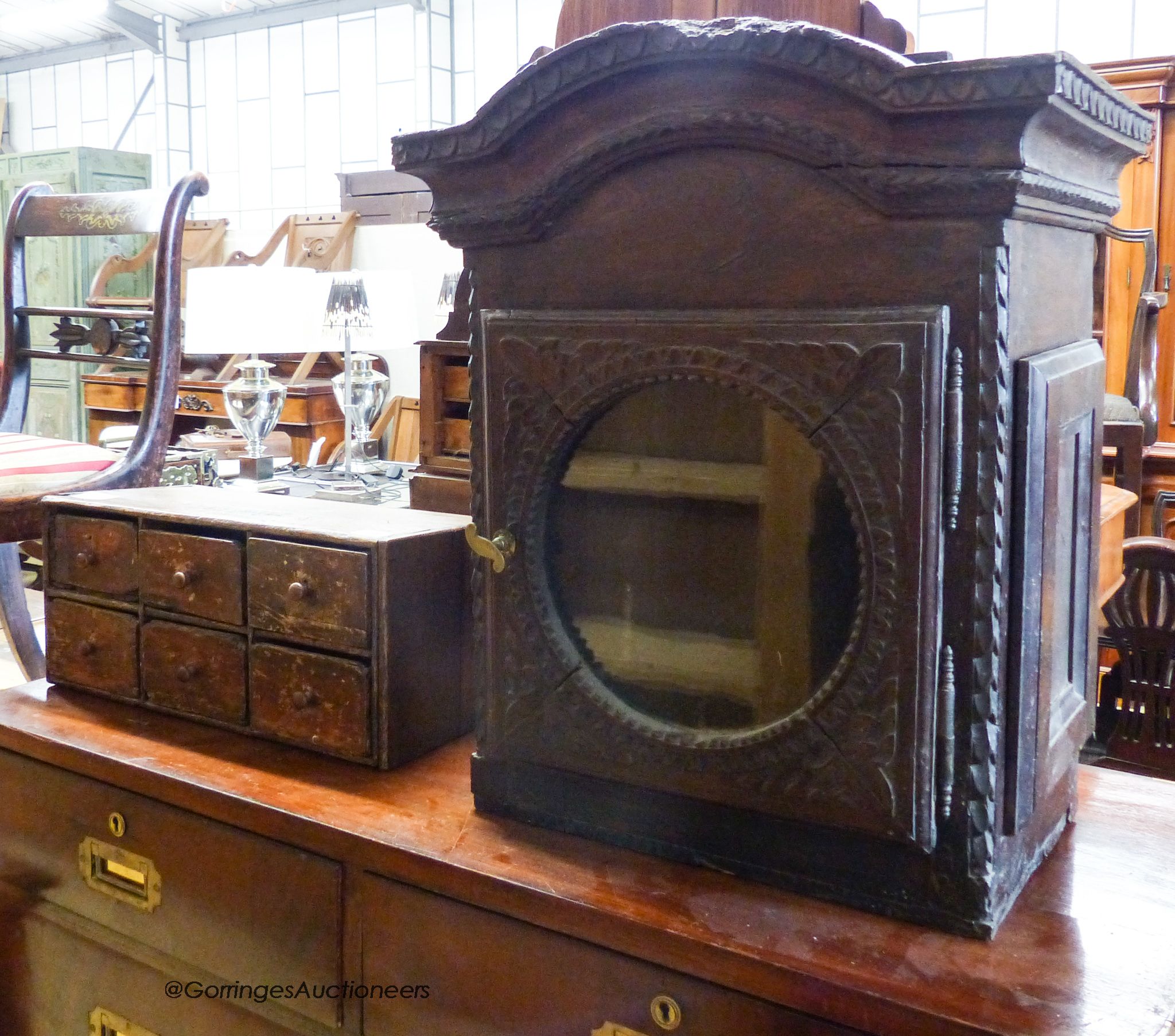 A nest of six drawers and a clock hood